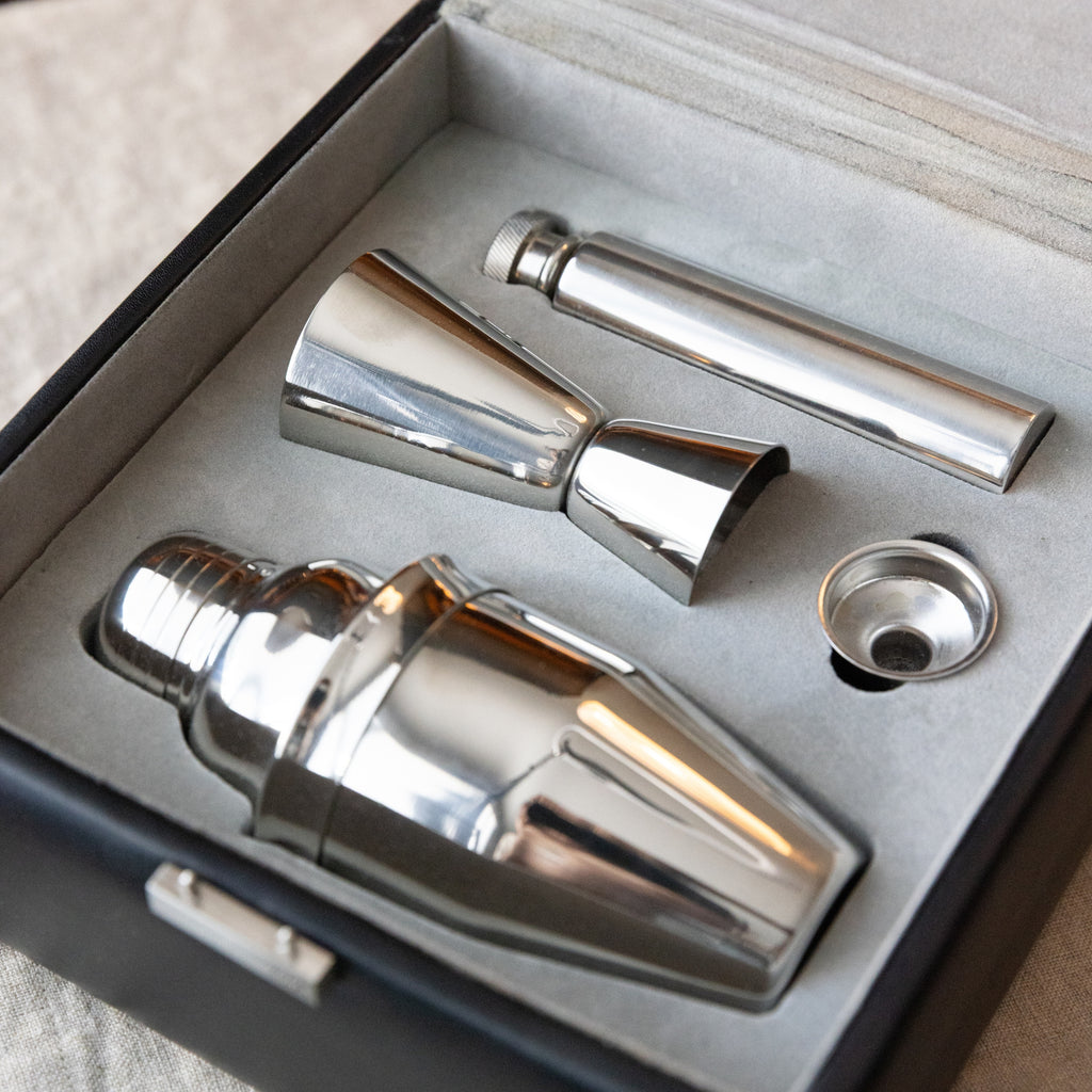 Set of silver cocktail shakers and jigger in a box