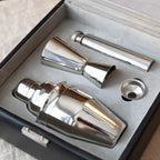 Set of silver cocktail shakers and jigger in a box