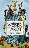 Book cover of 'The Weiser Tarot' with illustrations of three figures holding tarot cards against a blue sky.