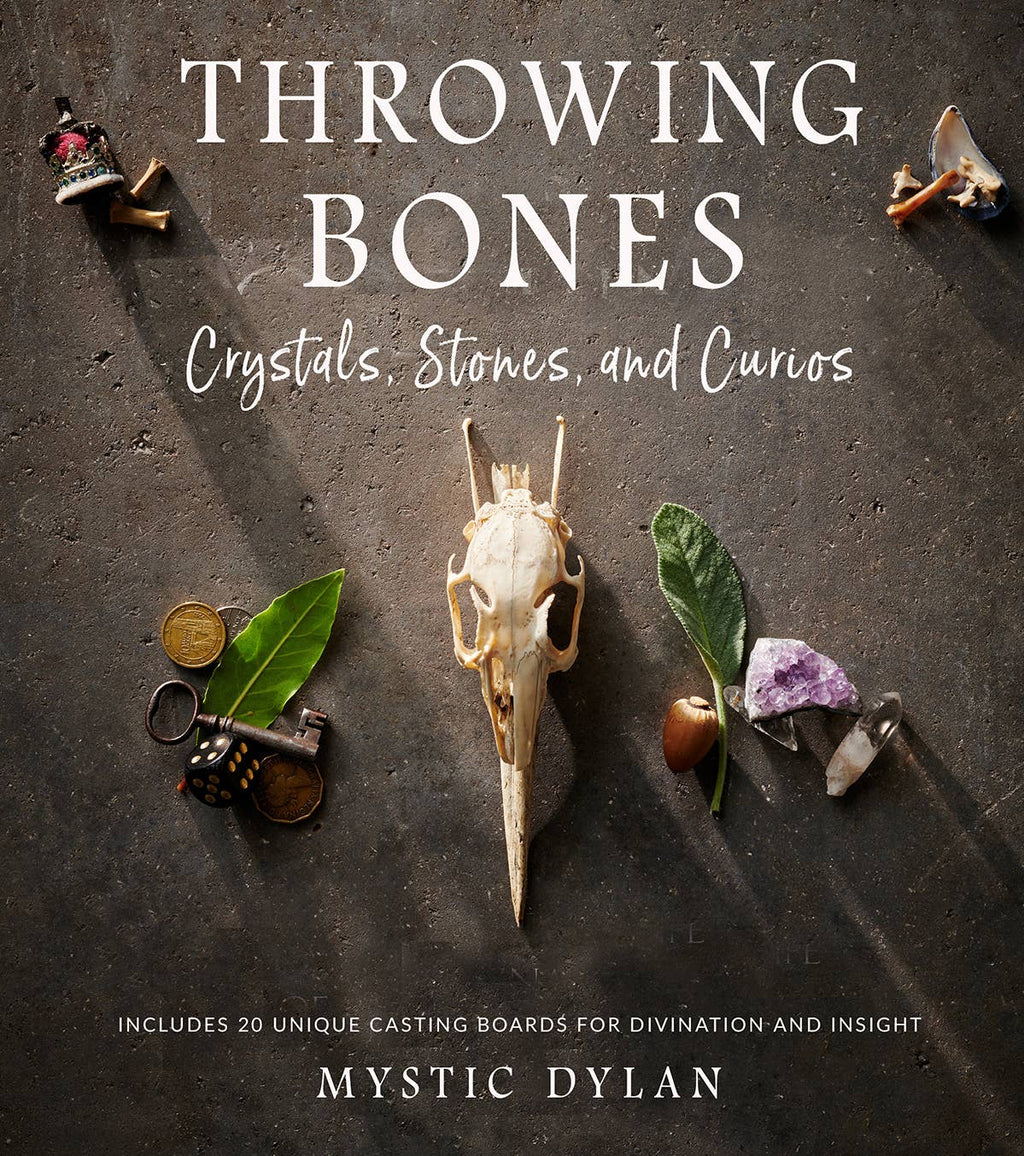 Book cover of 'Throwing Bones: Crystals, Stones, and Curios' by Mystic Dylan with various items on a dark background.